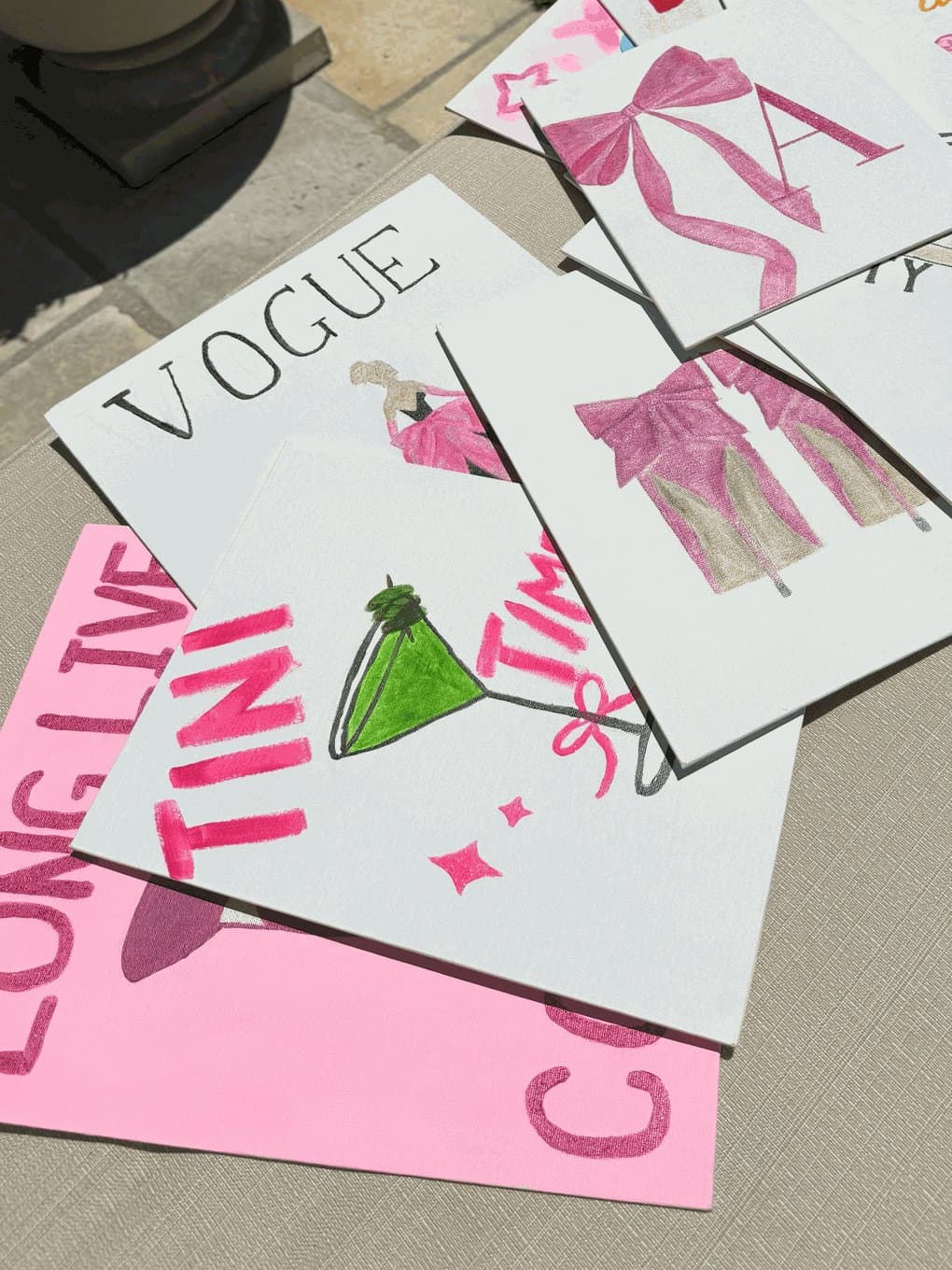 A spread of Avery Zenz's fashion-inspired paintings, including a Vogue cover and pink bows